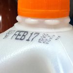 A milk jug stamped with an expiration date